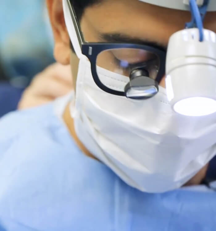 Picture of Dr Dhir with mask and testing glasses