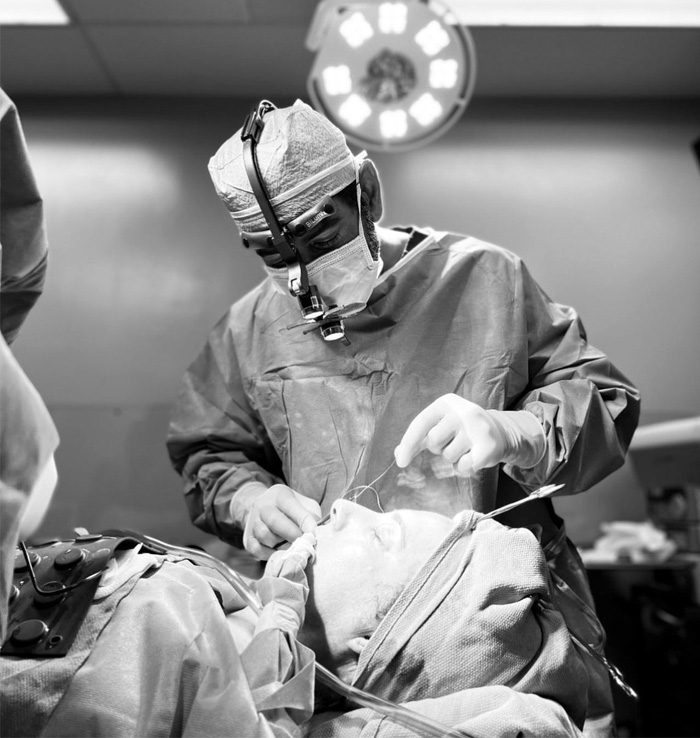 Dr Dhir working on his patient in an operation theatre