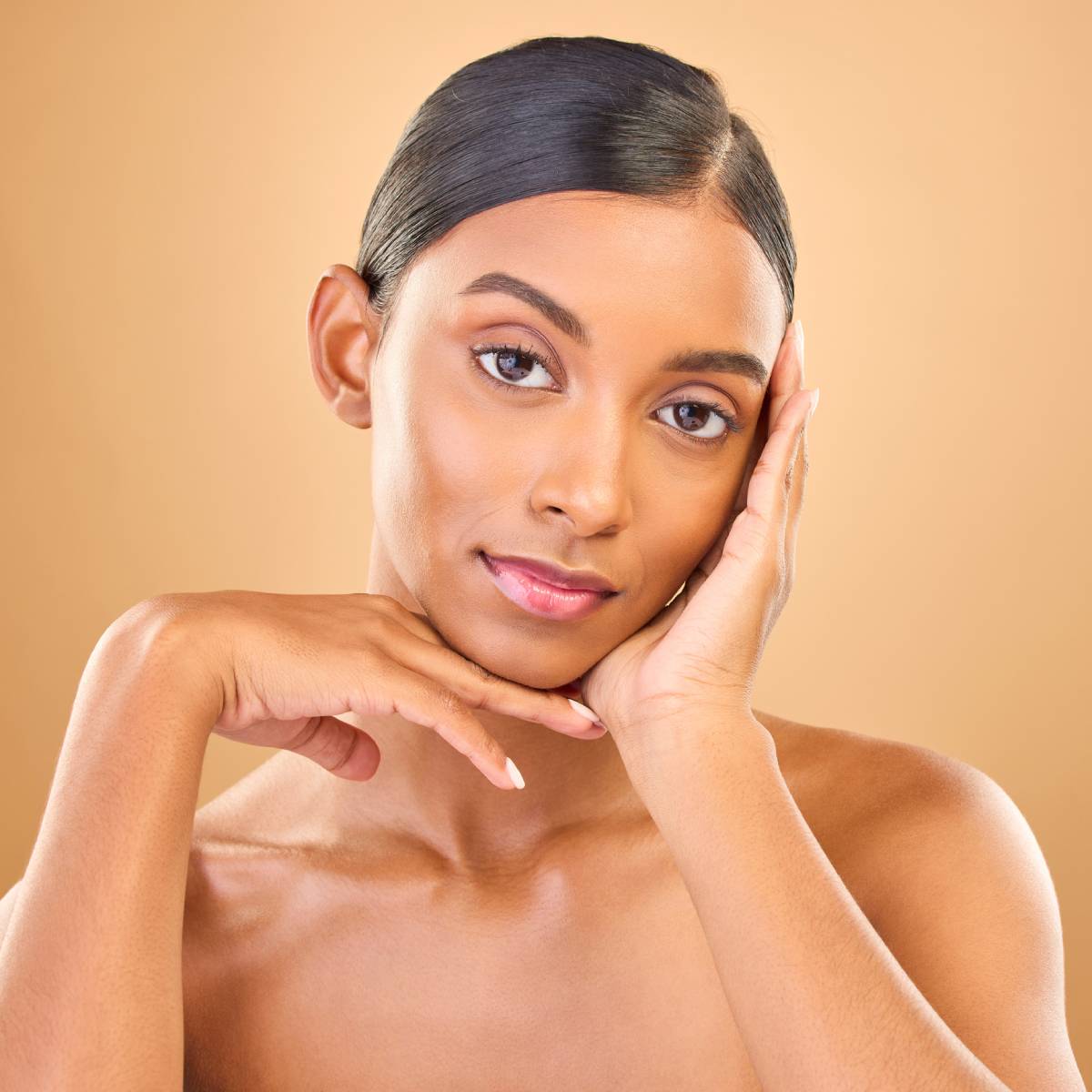 Face portrait, skincare and beauty of woman in studio isolated on brown background.